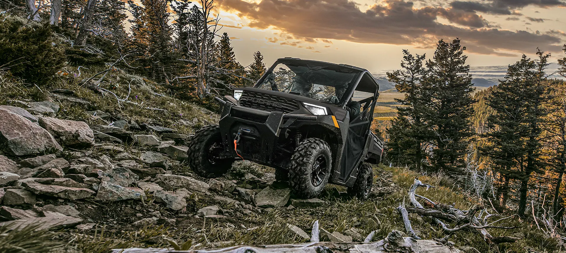Polaris RANGER 1000 UTV driving over rocky terrain with ease.
