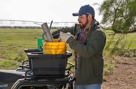 Polaris Sportsman 450 H.O. ATV with storage accessories installed on the cargo rack.
