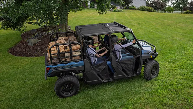 Overhead view of people hauling wood with a Polaris RANGER UTV.