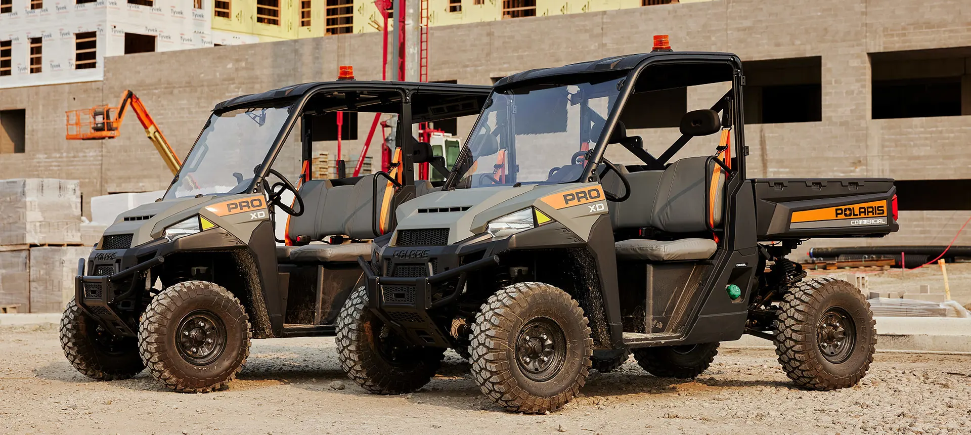 Polaris Pro XD UTVs being used for grounds and facility operations on a jobsite.
