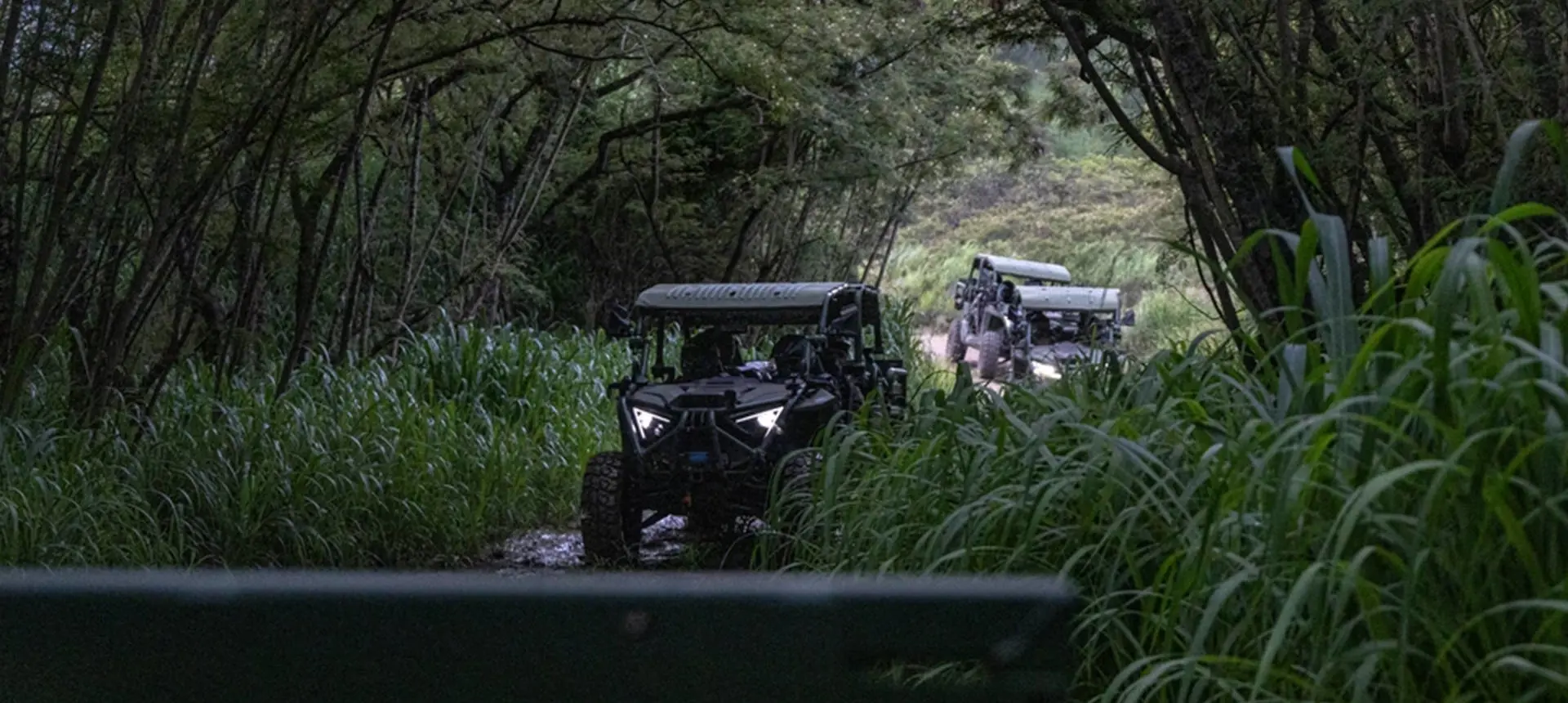 3 MRZR Alpha military tactical side-by-sides driving in the jungle.