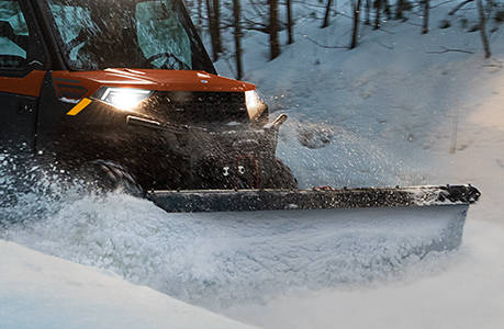 A plow system installed on a Polaris RANGER 1000 UTV.