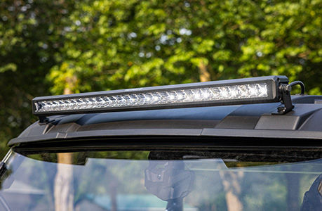 A Polaris RANGER 500 UTV with lighting accessories installed.