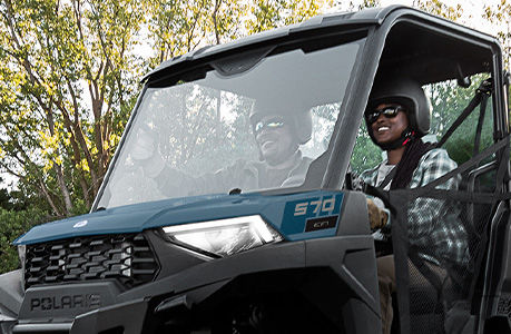 A windshield installed on a Polaris RANGER SP 570 UTV.