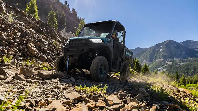 A Polaris RANGER SP 570 UTV driving over rocky terrain with ease.