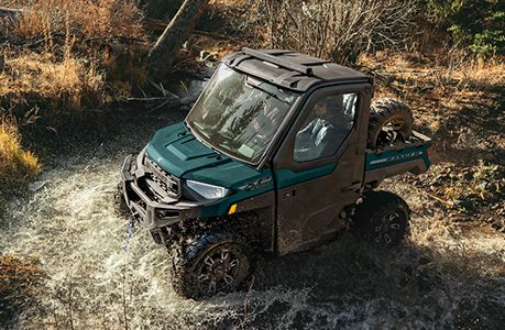 A Polaris RANGER XP 1000 NorthStar Edition UTV with spare tire carrier accessory installed. 