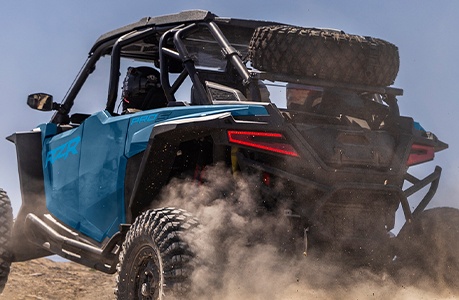 A Polaris RZR Pro S with spare tire carrier accessory installed. 