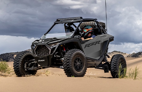 A Polaris RZR Pro S with windshield accessory installed. 