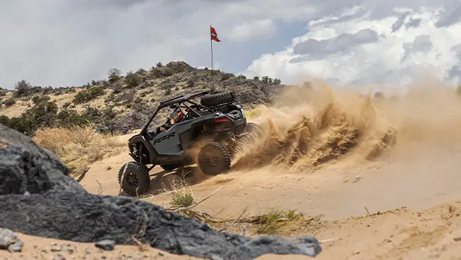 Polaris RZR Pro S side-by-side throwing sand in the desert.