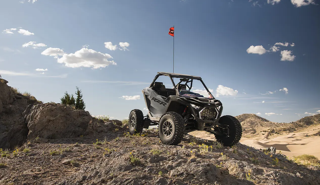 Polaris RZR Pro S side-by-side parked on a rocky hill in the desert.