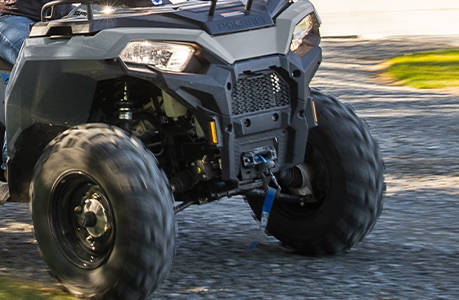 Polaris Sportsman 450 H.O. ATV with a winch installed on the front end. 