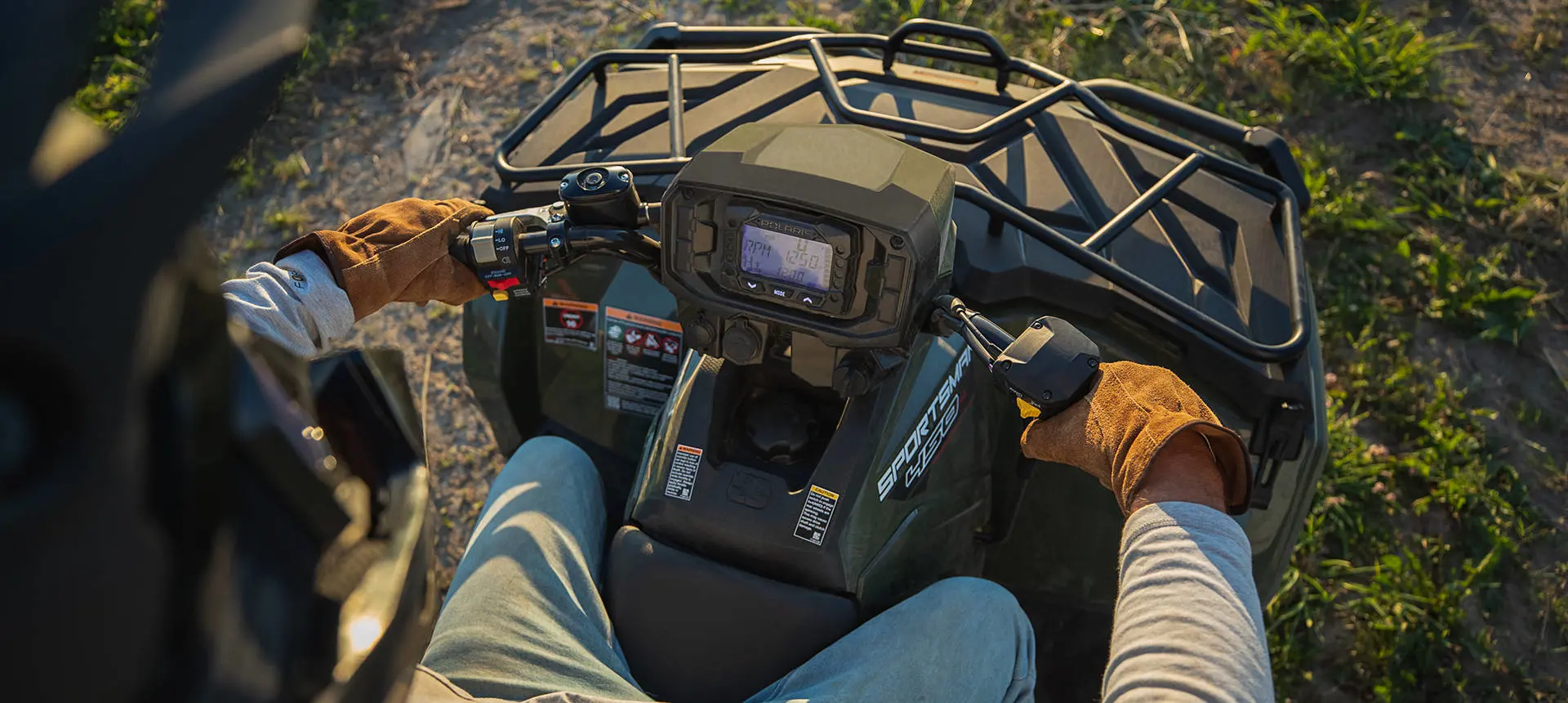 Aerial view of the handle bars on a Polaris Sportsman 450 H.O. ATV.