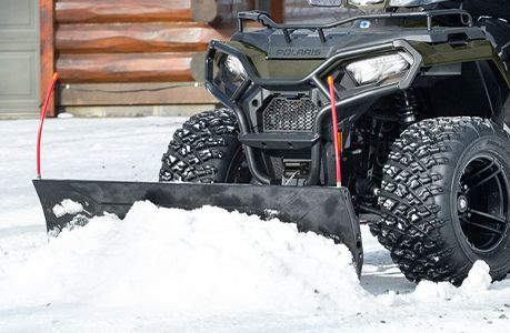 Polaris Sportsman 570 ATV with plow system accessory installed.