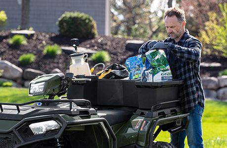 Polaris Sportsman 570 ATV with rear cargo box accessory installed.