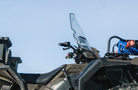 A Polaris Sportsman 850 ATV with winch accessory installed.