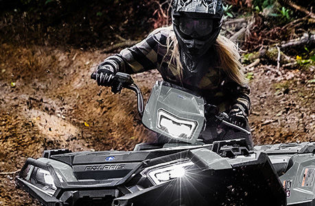 A Polaris Sportsman XP 1000 Ultimate ATV with grip warmer accessories installed.