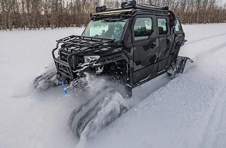 A Polaris XPEDITION ADV NorthStar with tracks installed.