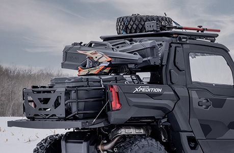 A Polaris XPEDITION performance side-by-side with storage rack accessories installed. 