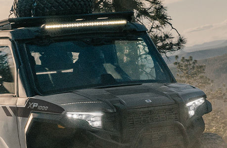 A Polaris XPEDITION performance side-by-side with lighting accessories installed. 