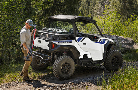 A Polaris GENERAL SxS with storage rack accessories installed. 