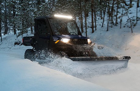 A plow system installed on a Polaris RANGER 1000 UTV.