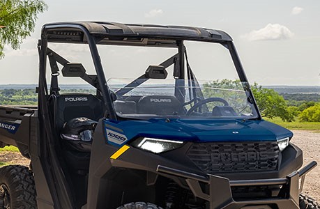A Polaris RANGER 1000 UTV with a half windshield installed.