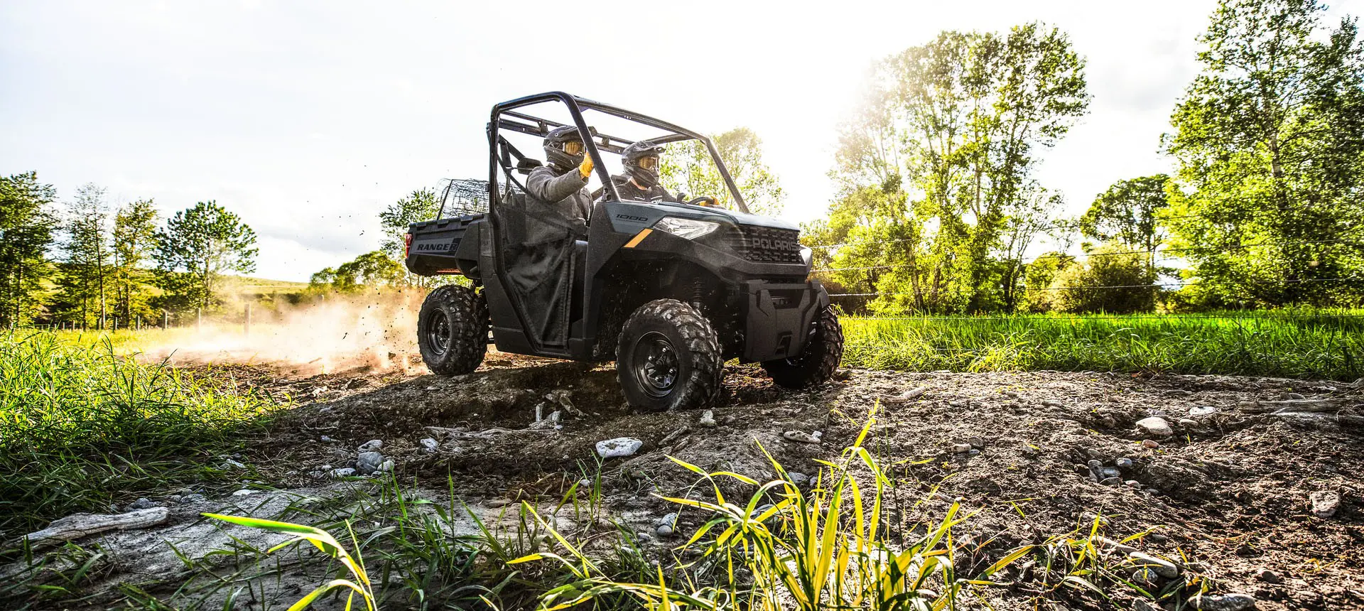 2 riders in a Polaris RANGER 1000 UTV.
