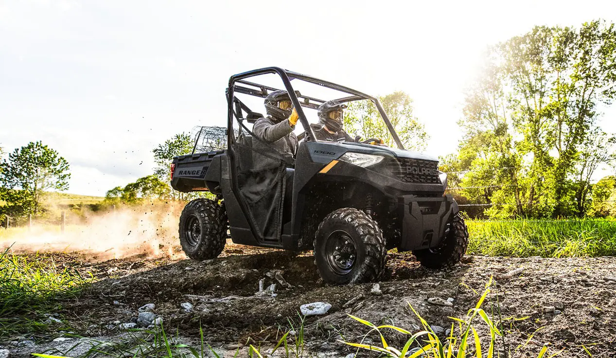 2 riders in a Polaris RANGER 1000 UTV.