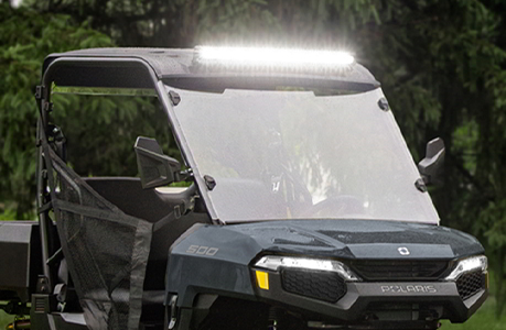 A Polaris RANGER 500 UTV with windshield installed.