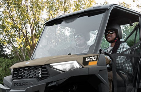 A windshield installed on a Polaris RANGER 600 UTV.