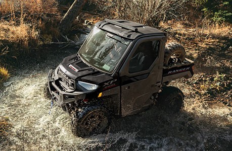 A Polaris RANGER XP 1000 NorthStar UTV with a spare tire carrier installed.