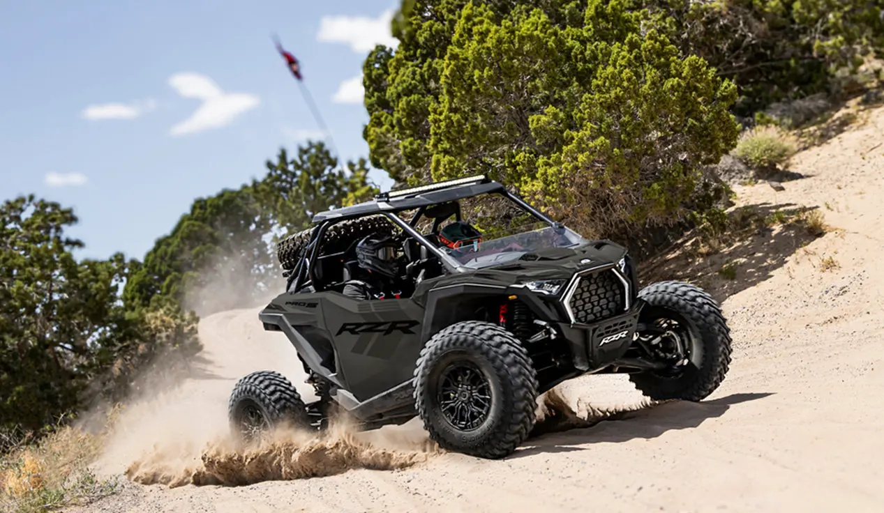 Polaris RZR Pro S side-by-side throwing sand on a corner.