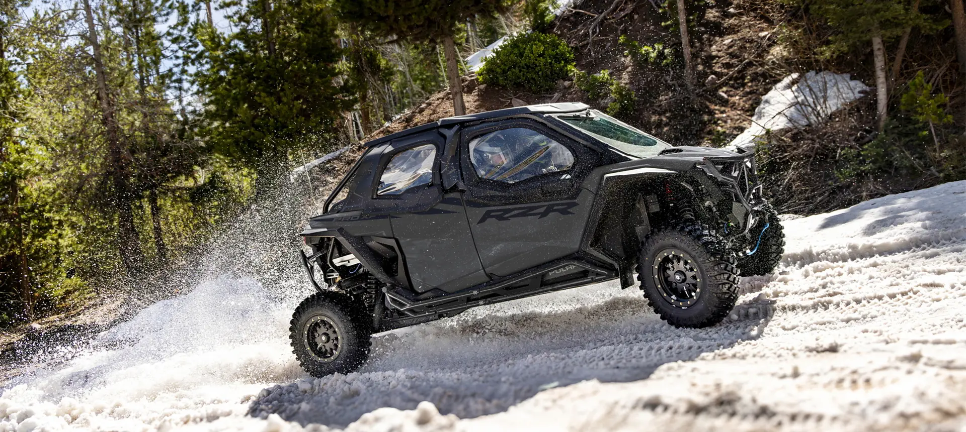 A Polaris RZR Pro XP 4 side-by-side with canvas upper door accessories installed.