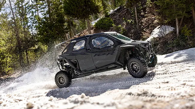 A Polaris RZR Pro XP 4 side-by-side with canvas upper door accessories installed.