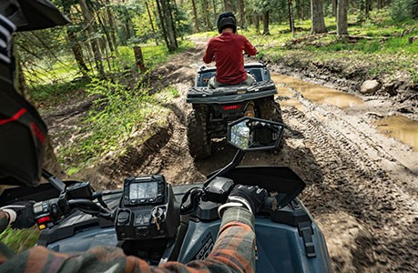 A Polaris Sportsman 500 ATV with sideview mirrors installed.