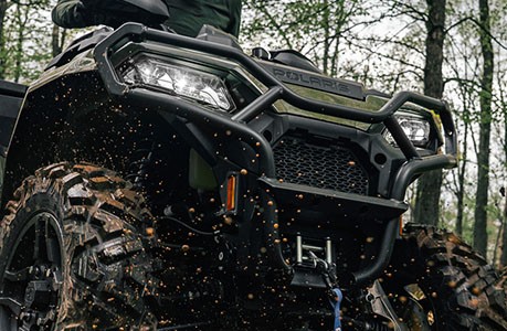 A Polaris Sportsman 500 ATV with a front bumper installed.