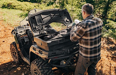 Polaris Sportsman 600 ATV with rear cargo box accessory installed.