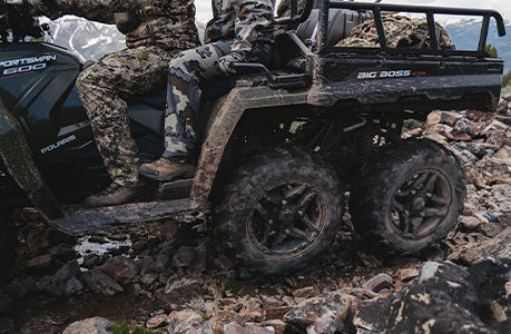 Side profile of a Polaris Sportsman 6x6 600 ATV showcasing the heated driver seat accessory.