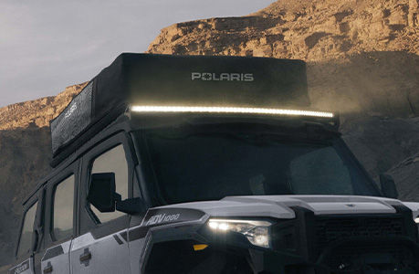 A Polaris XPEDITION ADV NorthStar with lighting accessories installed.
