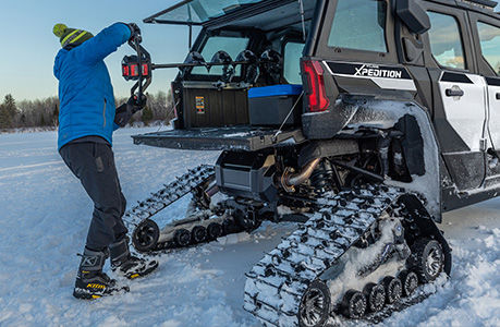 A Polaris XPEDITION ADV NorthStar with tracks installed.