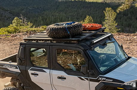 A Polaris XPEDITION performance side-by-side with storage rack accessories installed. 