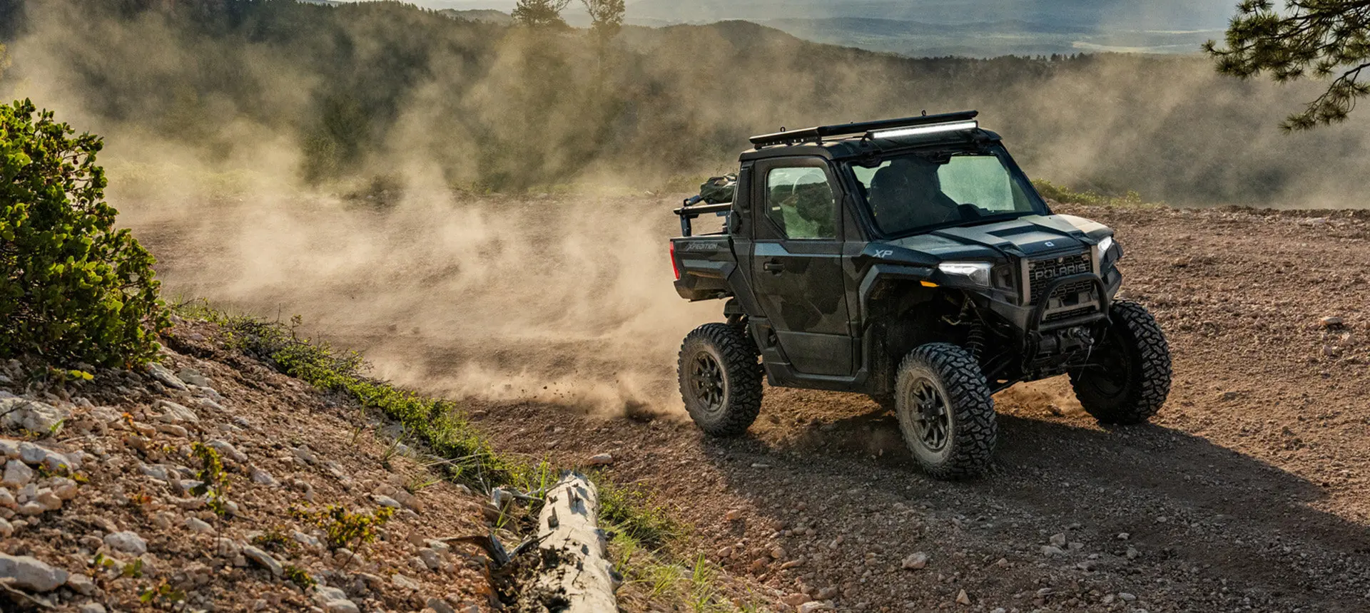 A Polaris XPEDITION XP side-by-side cruising on a trail.