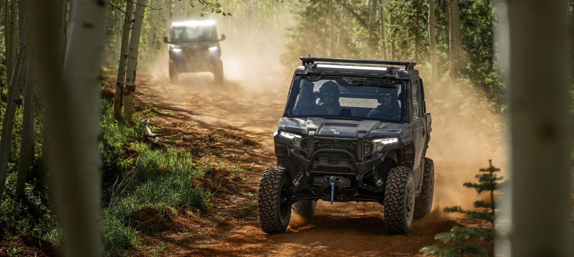 Two Polaris XPEDITION XP NorthStar side-by-sides cruising on a trail.