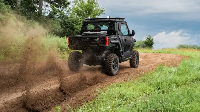 Rear view of a Polaris XPEDITION XP NorthStar side-by-side trail riding.
