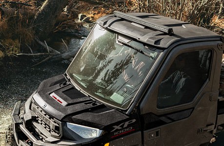 Polaris RANGER XP Kinetic with a windshield installed.