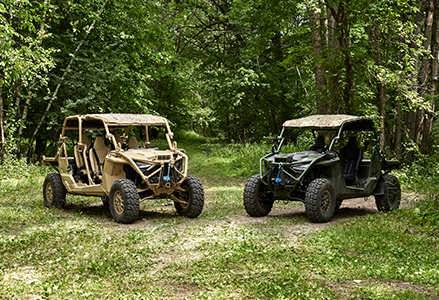 Two MRZR Alpha vehicles parked next to each other