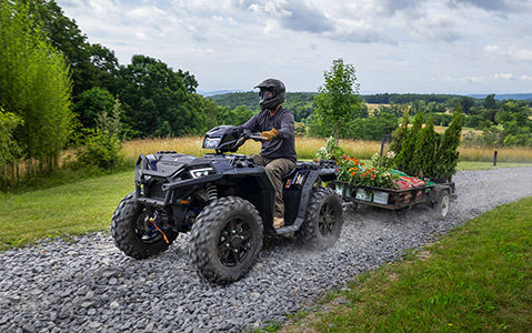 Polaris Sportsman towing some garden plants