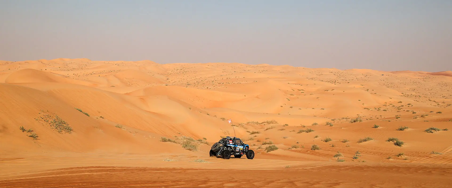 Dakar Rally RZR Pro R Factory vehicle driving through the desert.