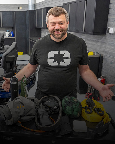 Pat McArdle inside the Polaris garage with some Sportsman ATVs ready for a new episode of Shop Talk.