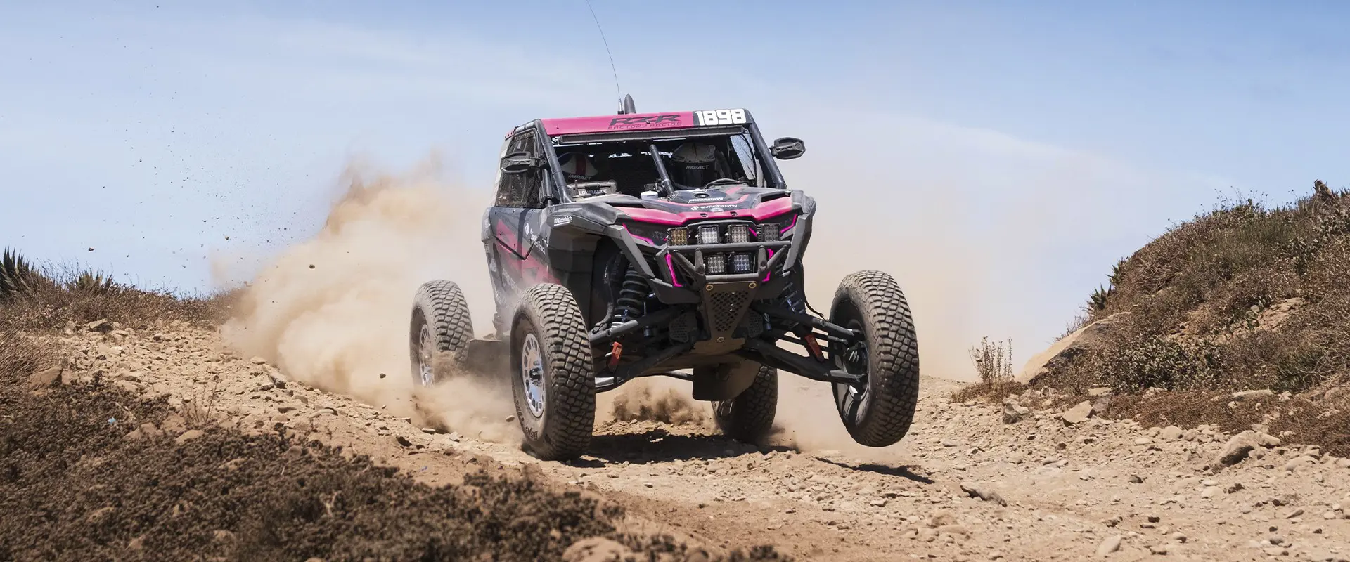 2025 Polaris RZR Pro R Factory SxS descending a rocky hill.